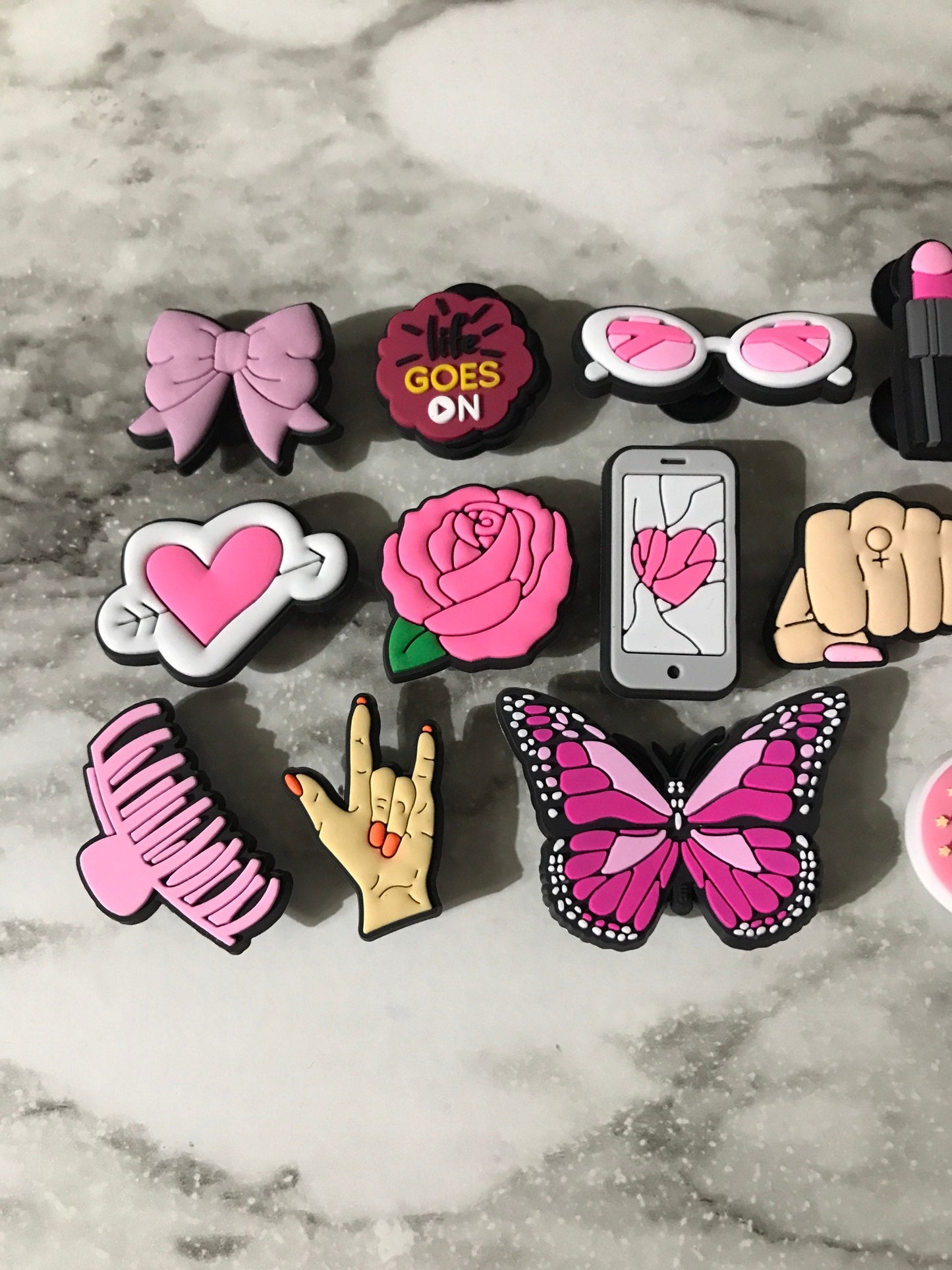 new trending pink and black charms for your crocs, croc compatible black and pink shoe charms, trending shoe charms, butterfly, fist