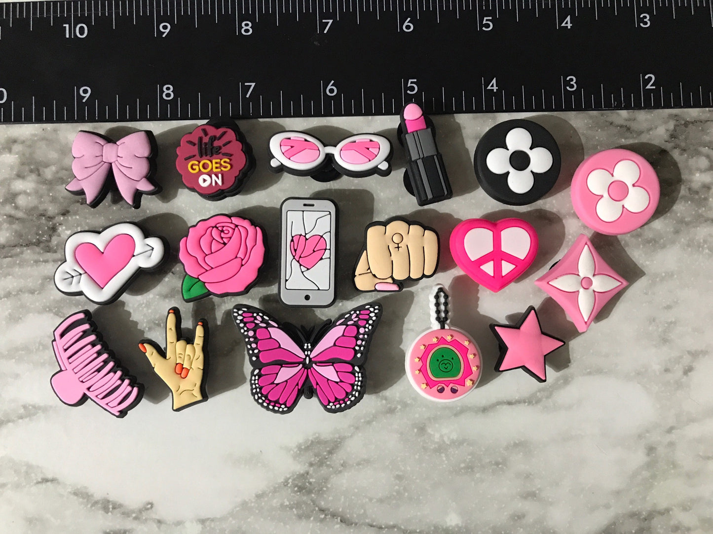 new trending pink and black charms for your crocs, croc compatible black and pink shoe charms, trending shoe charms, butterfly, fist