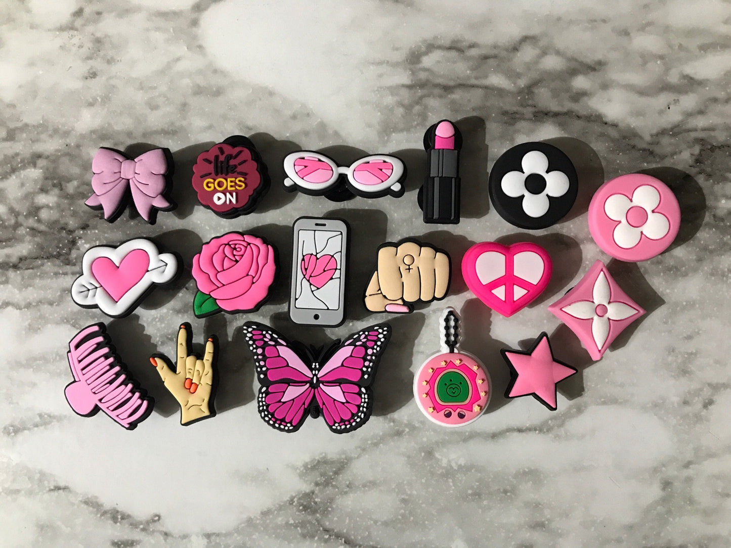 new trending pink and black charms for your crocs, croc compatible black and pink shoe charms, trending shoe charms, butterfly, fist