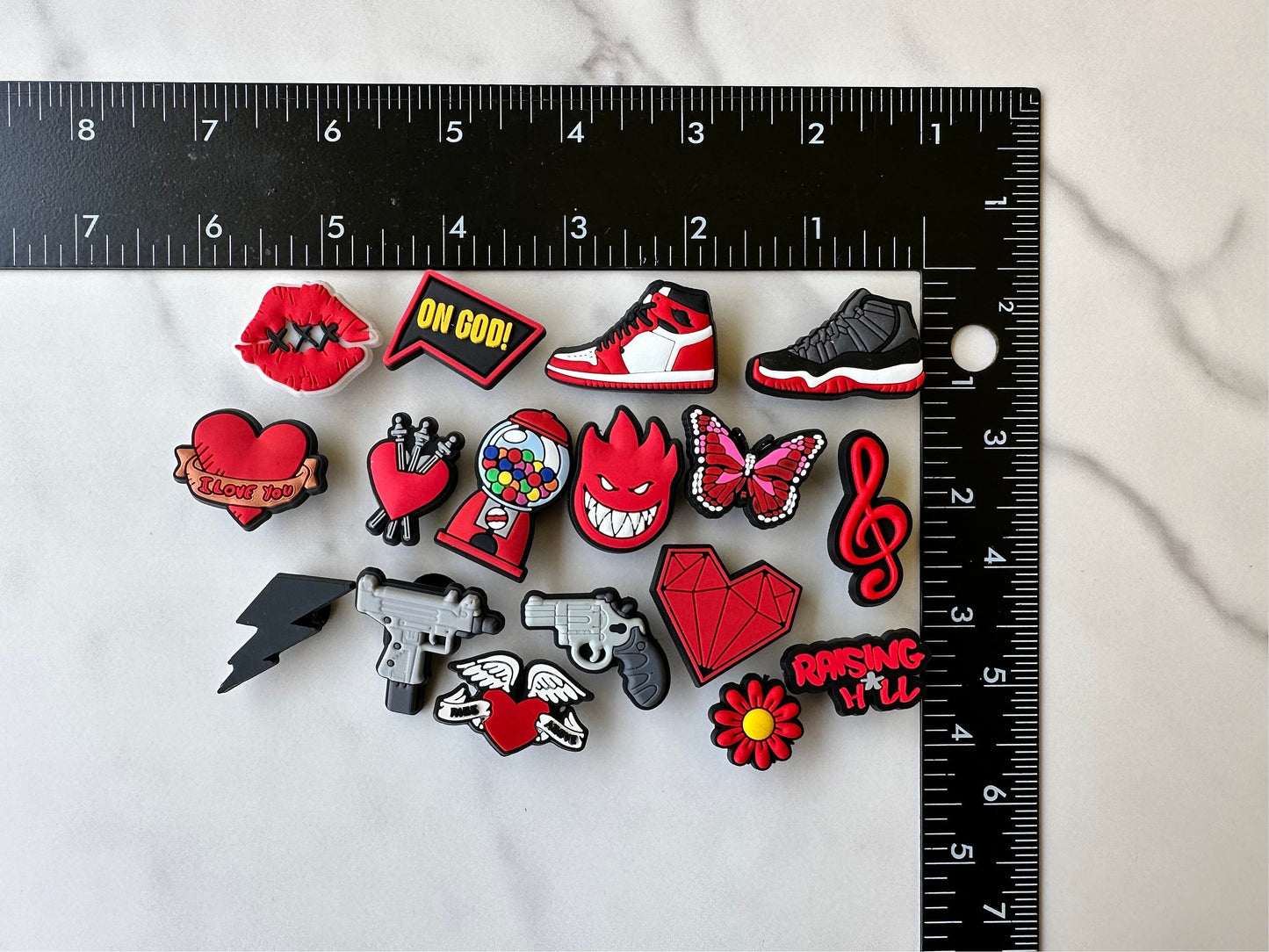 Brand new trending shoe charms for your crocs. Popular croc compatible charms, red and black shoe charms, heart charms, butterfly