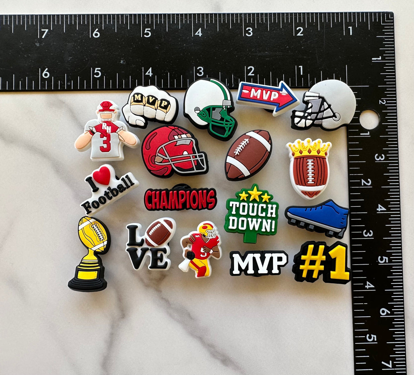 football themed shoe charms for your crocs, croc compatible charms, mvp shoe pins, helmet button for crocs, cleat charm